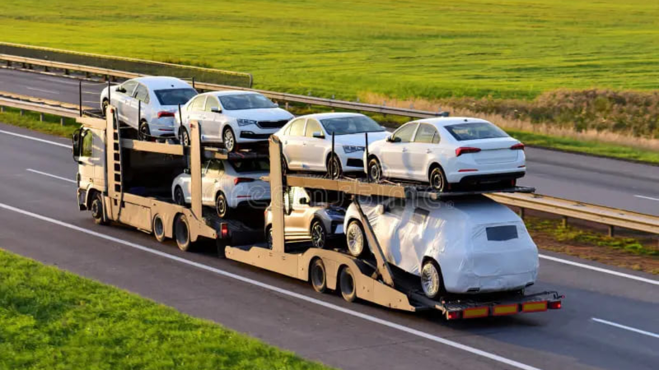 car-carrier-trailer-transports-cars-highway-sunset-background-auto-transport-shipping-services-concept-truck-semi-212991393 (1)